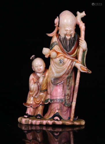 A SOAPSTONE CARVED PAINTED LIFELESS BUDDHA