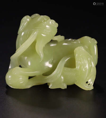 A HETIAN YELLOW JADE CARVED LION SHAPED PENDANT