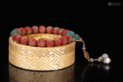 A CORAL CARVED BEADS STRING BRACELET