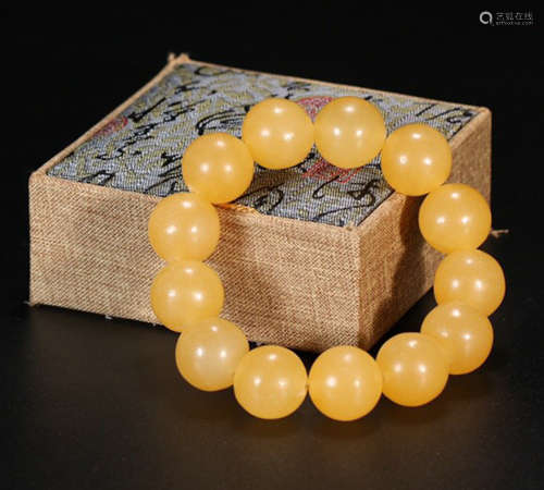 A SOAPSTONE CARVED BEADS STRING BRACELET