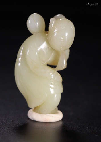 A HETIAN JADE CARVED FIGURE SHAPED STATUE