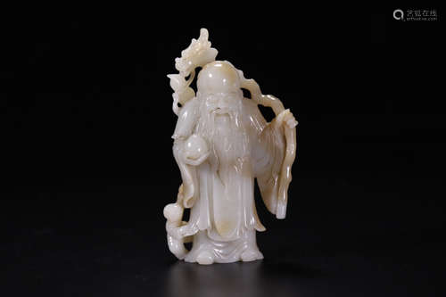 A HETIAN JADE CARVED LIFELESS BUDDHA PENDANT