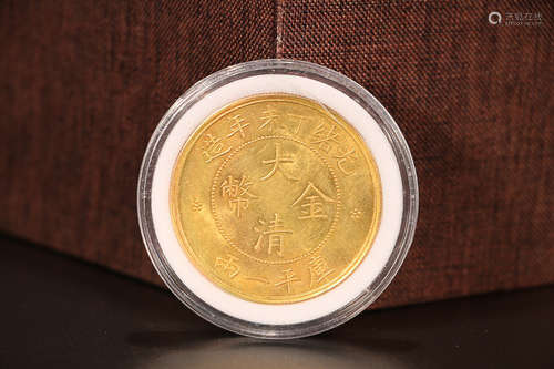 A GOLD COIN OF QING DYNASTY