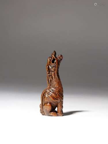 A JAPANESE WOOD NETSUKE OF A KIRIN MEIJI 1868 1912...;