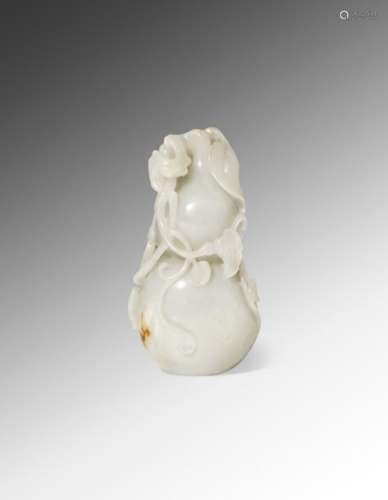 A CHINESE PALE CELADON JADE CARVING OF A GOURD QIA...;