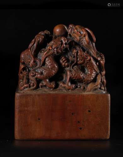 A Carved Sandalwood 'Nine Dragons' Seal