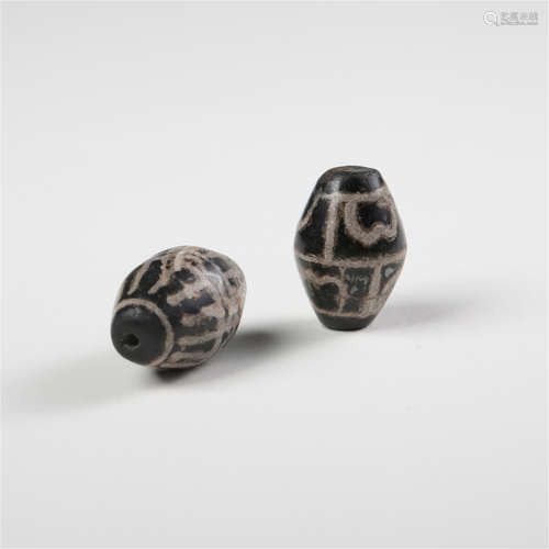 TWO CHINESE DZI BEADS TAND DYNASTY