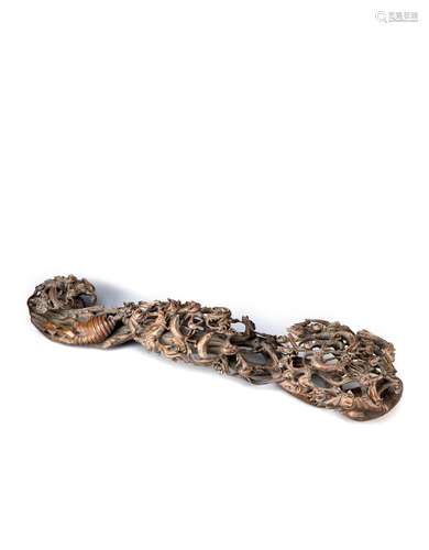 A LARGE RETICULATED CHINESE WOOD RUYI SCEPTRE LATE QING DYNASTY Carved throughout with chilong and