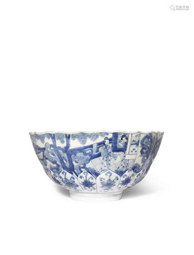 A CHINESE BLUE AND WHITE LOTUS-MOULDED BOWL SIX CHARACTER KANGXI MARK AND OF THE PERIOD 1662-1722