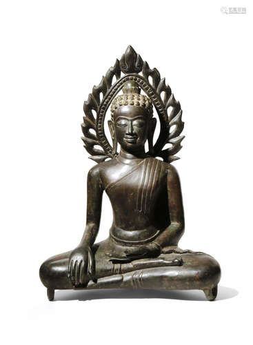 A SOUTHEAST ASIAN BRONZE FIGURE OF BUDDHA 19TH/20TH CENTURY Seated in dhyanasana, with his left hand