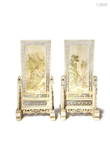 A PAIR OF CHINESE IVORY TABLE SCREENS QING DYNASTY Each carved in shallow relief with a scene of