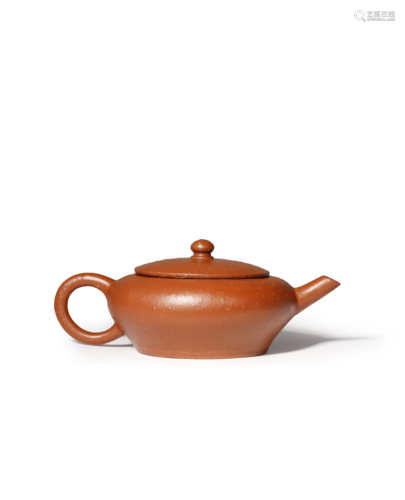 A CHINESE YIXING TEAPOT AND COVER QING DYNASTY The flattened body tapering towards the foot, set