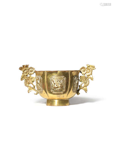 A CHINESE GILT-BRONZE CUP 18TH CENTURY The lobed body formed as a flowerhead, cast in relief with