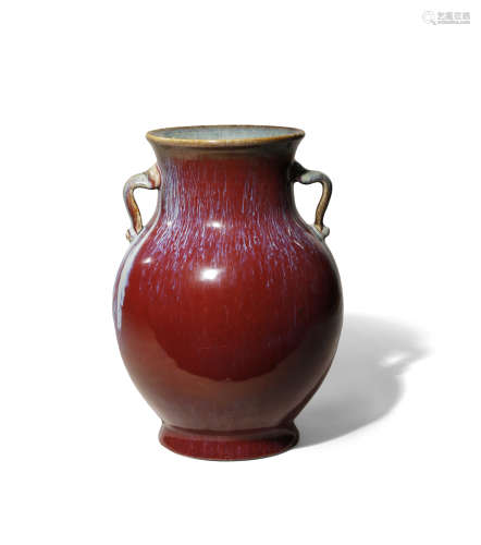 A CHINESE FLAMBE GLAZED VASE 20TH CENTURY The rounded body coated in a rich purple-red glaze with