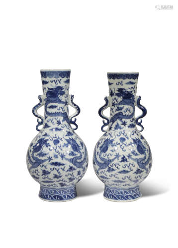 A PAIR OF CHINESE BLUE AND WHITE 'DRAGON' VASES 19TH CENTURY Each painted with three scaly dragons