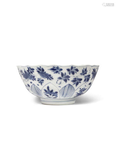 A CHINESE BLUE AND WHITE LOTUS-MOULDED BOWL SIX CHARACTER KANGXI MARK AND OF THE PERIOD 1662-1722