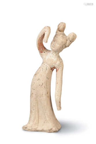 A CHINESE POTTERY MODEL OF A DANCER TANG DYNASTY Standing, wearing a long robe with elongated