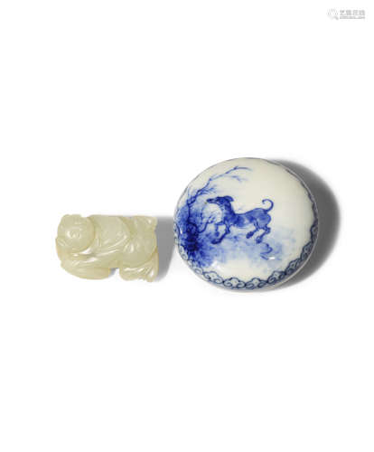 A CHINESE BLUE AND WHITE SEAL PASTE BOX AND COVER AND A JADE CARVING OF A BOY 19TH AND 20TH