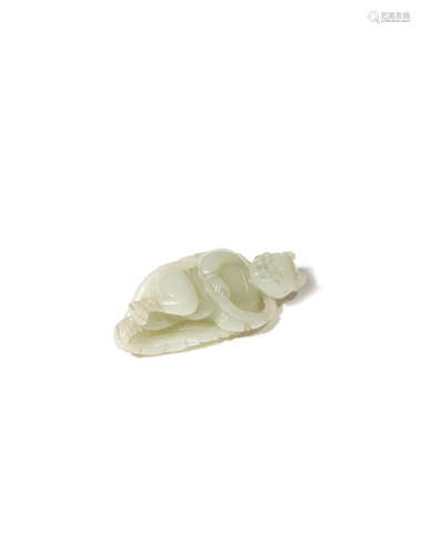 A CHINESE PALE CELADON JADE CARVING OF A BOY ON A LEAF 18TH/19TH CENTURY The boy reclines on the