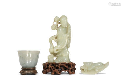 TWO CHINESE PALE CELADON JADE CARVINGS AND AN AGATE CUP QING DYNASTY One carving of a lady