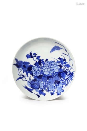 A CHINESE BLUE AND WHITE DISH LATE QING DYNASTY The well decorated with a large bouquet of