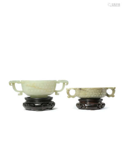 TWO CHINESE JADE TWO-HANDLED BOWLS MING AND QING DYNASTY Each carved with a band of raised studs,