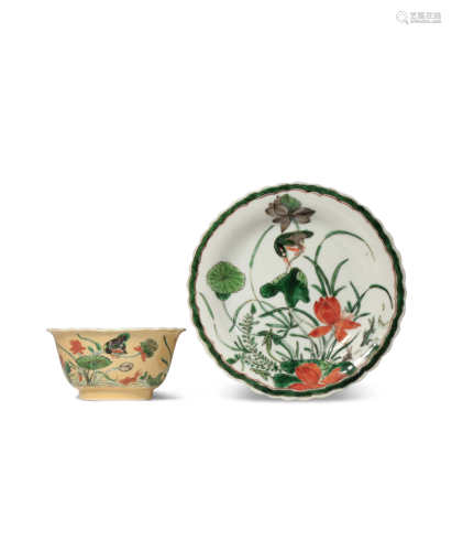 A CHINESE FAMILLE VERTE CAFE-AU-LAIT GROUND TEA BOWL AND SAUCER KANGXI 1662-1722 Each painted in