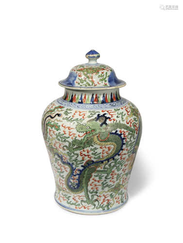 A CHINESE WUCAI 'DRAGON AND PHOENIX' BALUSTER VASE AND COVER PROBABLY 17TH CENTURY Painted with