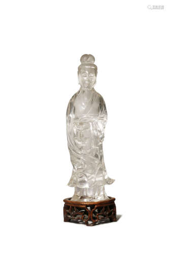 A CHINESE ROCK CRYSTAL FIGURE OF GUANYIN LATE QING DYNASTY She stands, wearing long flowing robes,