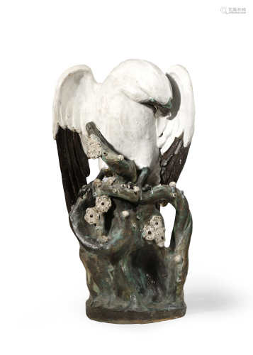 A LARGE CHINESE SHIWAN WARE MODEL OF AN EAGLE 19TH CENTURY The white bird tucking his head under his