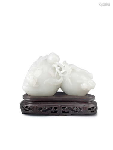 A CHINESE WHITE JADE CARVING OF PEACHES AND MONKEYS 20TH CENTURY Depicting two large and three small