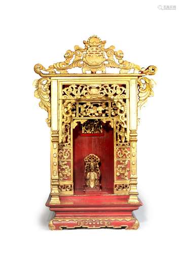 A CHINESE LACQUERED AND GILT-WOOD SHRINE 19TH CENTURY Brightly decorated with gilt and red