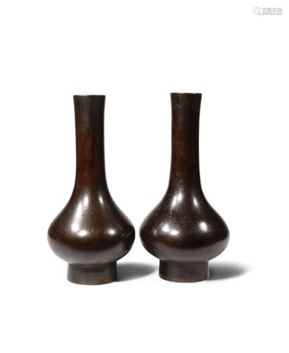 A PAIR OF CHINESE BRONZE VASES 17TH CENTURY Each with a pear-shaped body supported on a gently