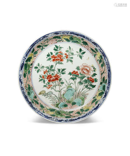 A CHINESE FAMILLE VERTE DISH KANGXI 1662-1722 Painted in coloured enamels with blossoming flowers