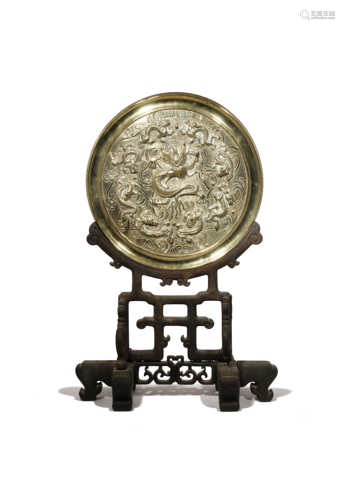 A CHINESE BRONZE CIRCULAR 'NINE DRAGON' MIRROR LATE QING DYNASTY Cast in relief with nine scaly