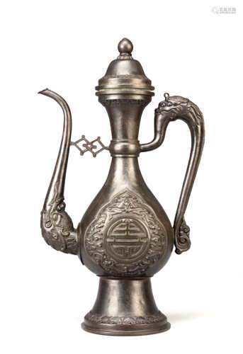 A CHINESE BRONZED COPPER TIBETAN-STYLE EWER AND COVER LATE QING DYNASTY The pear-shaped body cast