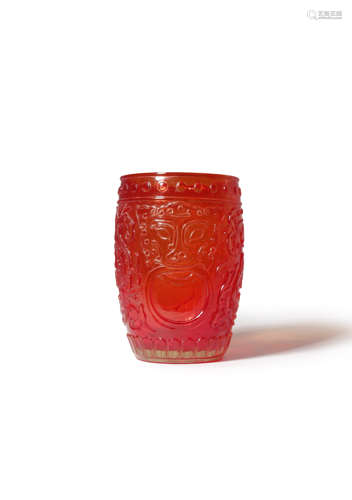 A CHINESE CARVED RUBY-RED GLASS BEAKER 18TH/19TH CENTURY The transparent barrel-shaped body carved