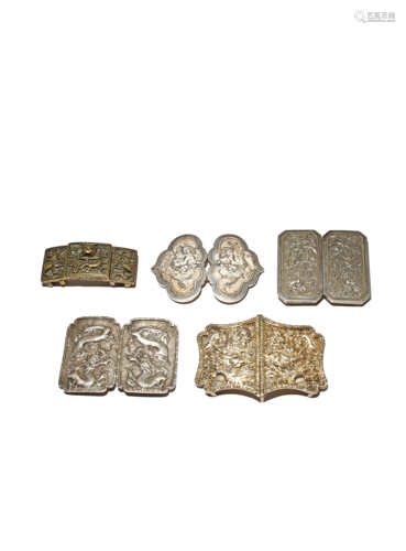 FIVE CHINESE METAL BELT BUCKLES QING DYNASTY/REPUBLIC PERIOD Comprising: a bronze belt buckle cast