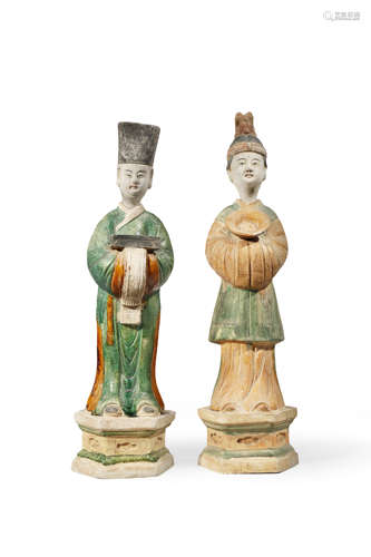 TWO CHINESE POTTERY FIGURES PROBABLY LATE MING DYNASTY Depicting two standing officials with