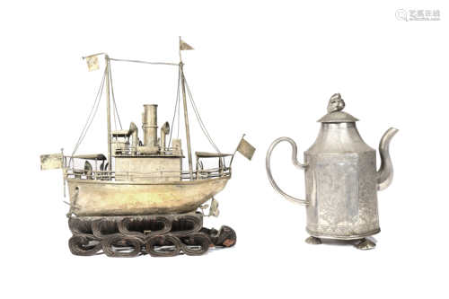 A CHINESE SILVER EWER AND COVER AND A SILVER MODEL OF A BOAT QING DYNASTY The ewer decorated with