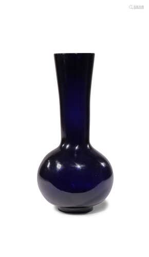 A CHINESE BEIJING BLUE GLASS BOTTLE VASE 18TH/19TH CENTURY The ovoid body rising to a tall gently