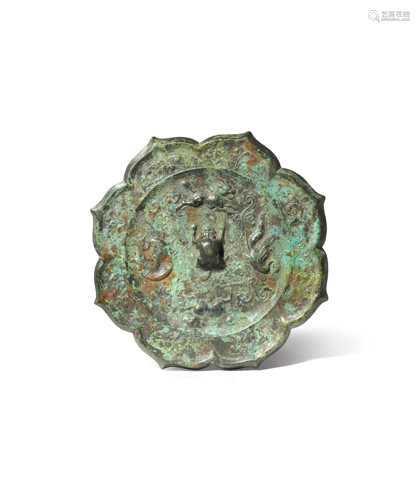 A CHINESE BRONZE MIRROR PROBABLY LATE QING DYNASTY Formed as a lotus flowerhead, cast with