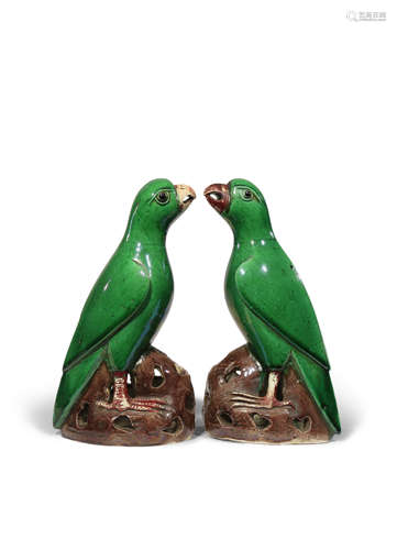 A PAIR OF CHINESE GREEN GLAZED MODELS OF PARROTS KANGXI 1662-1722 Each with its beak slightly open