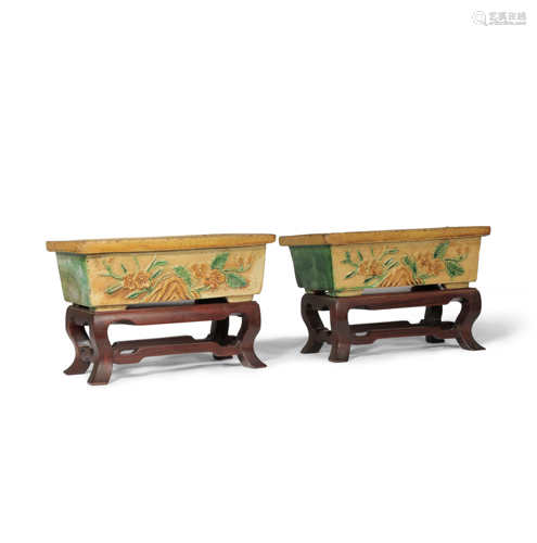 A PAIR OF CHINESE SANCAI RECTANGULAR JARDINIERES MING DYNASTY Each decorated in relief with