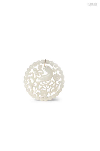 A CHINESE WHITE JADE OPENWORK PENDANT 19TH CENTURY Of circular form, carved with a parrot perched