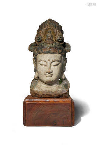 A CHINESE POLYCHROME CARVED WOOD HEAD OF GUANYIN PROBABLY LATE MING DYNASTY With downcast eyes and