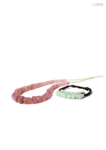 A CHINESE PINK TOURMALINE BEAD GRADUATED NECKLACE AND A JADEITE PENDANT 20TH CENTURY The necklace'