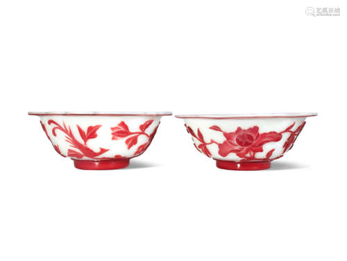 A NEAR PAIR OF CHINESE RED-OVERLAY GLASS BOWLS LATE QING DYNASTY Each decorated with prunus and