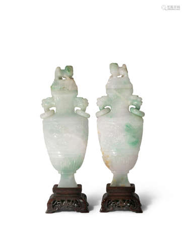 A PAIR OF CHINESE JADEITE VASES AND COVERS LATE QING DYNASTY Each of flattened form, carved in