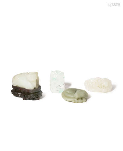 TWO CHINESE CELADON JADE ANIMAL CARVINGS AND TWO JADE PENDANTS 18TH AND 19TH CENTURY One a recumbent